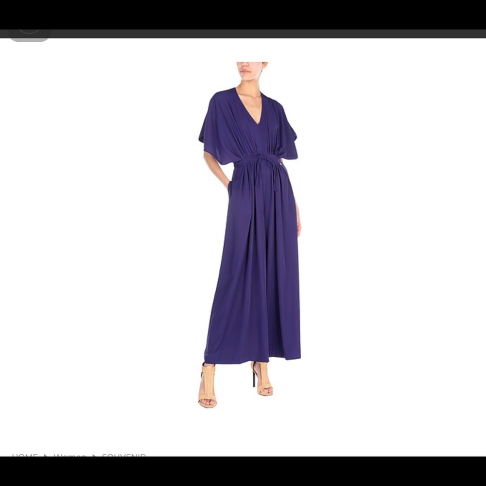 Gorgeous purple jumpsuit. 60” long size Medium, roomy with bell short sleeves.